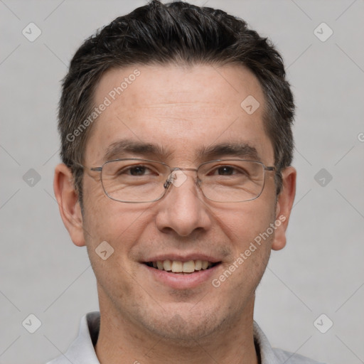 Joyful white adult male with short  brown hair and brown eyes