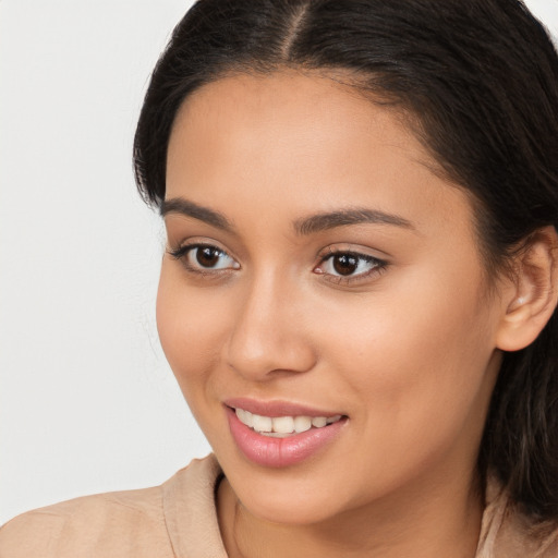 Joyful white young-adult female with long  brown hair and brown eyes