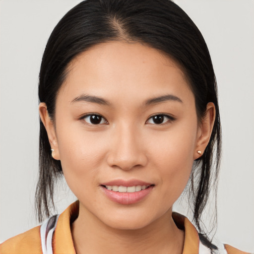 Joyful asian young-adult female with medium  brown hair and brown eyes