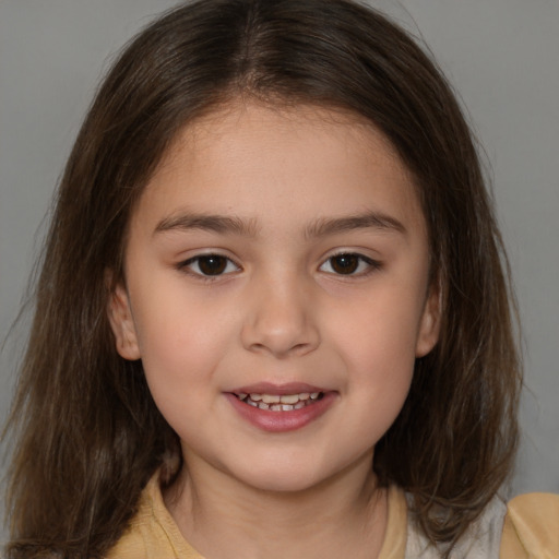 Joyful white child female with medium  brown hair and brown eyes