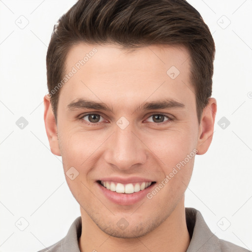 Joyful white young-adult male with short  brown hair and brown eyes