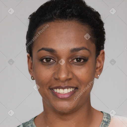 Joyful black young-adult female with short  black hair and brown eyes