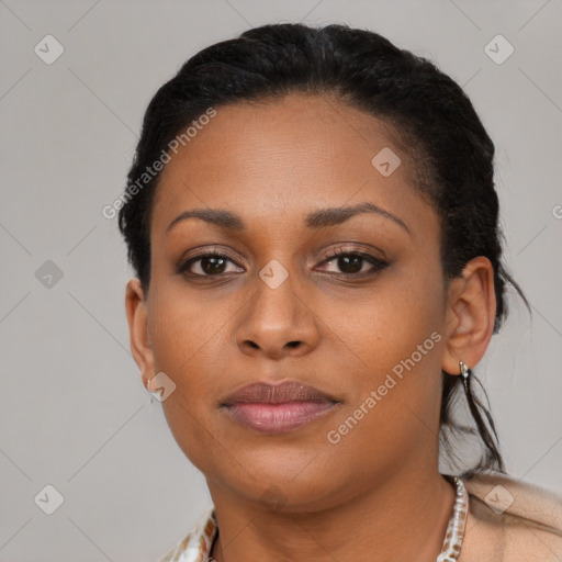 Joyful black young-adult female with short  brown hair and brown eyes