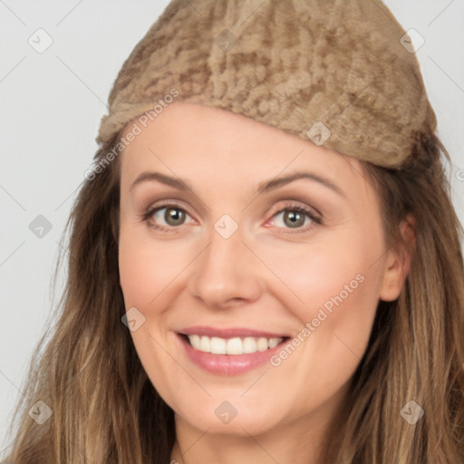 Joyful white young-adult female with long  brown hair and grey eyes