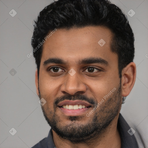 Joyful black young-adult male with short  black hair and brown eyes