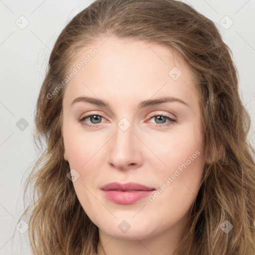 Joyful white young-adult female with long  brown hair and green eyes