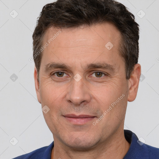 Joyful white adult male with short  brown hair and brown eyes