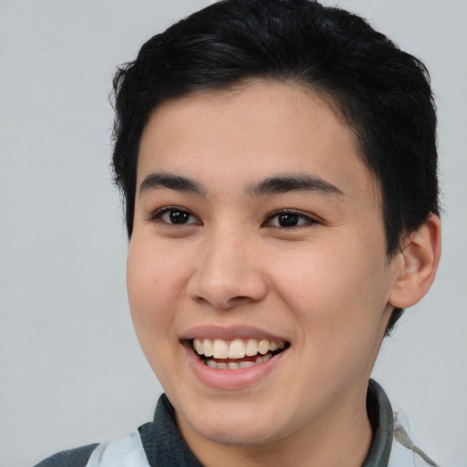 Joyful white young-adult male with short  black hair and brown eyes