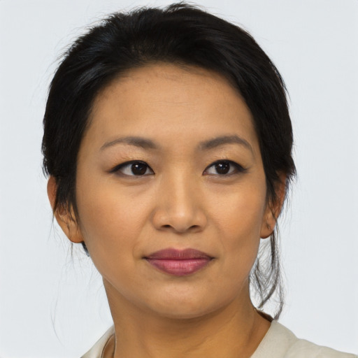 Joyful asian young-adult female with medium  black hair and brown eyes