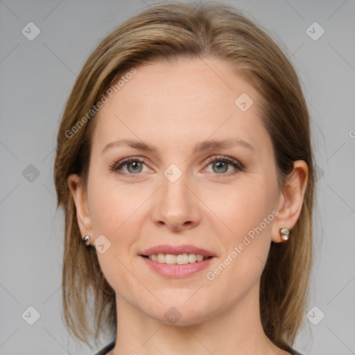 Joyful white young-adult female with medium  brown hair and grey eyes