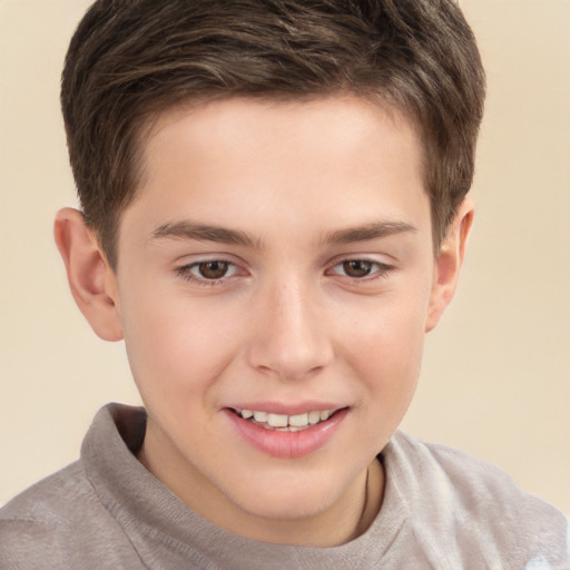 Joyful white child male with short  brown hair and brown eyes