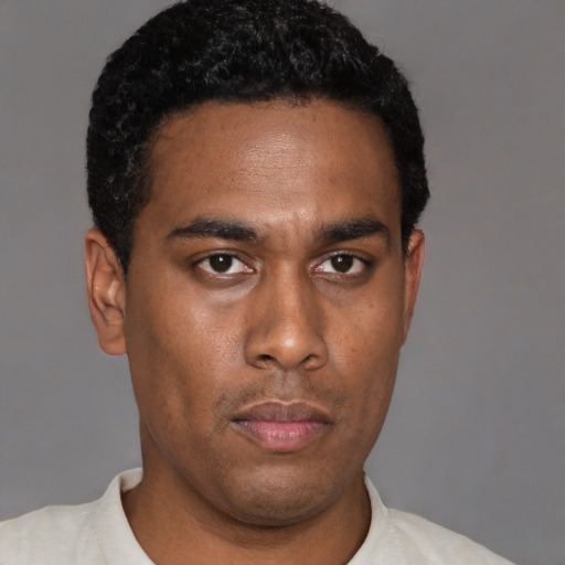Neutral latino young-adult male with short  black hair and brown eyes