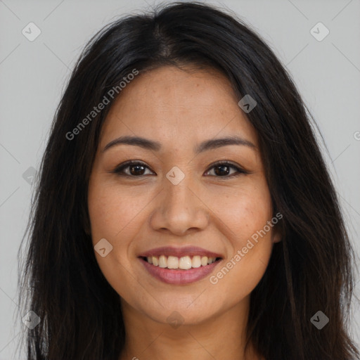 Joyful latino young-adult female with long  brown hair and brown eyes