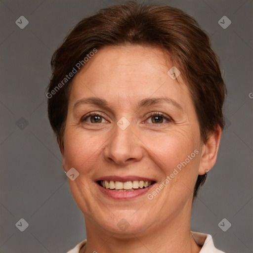 Joyful white adult female with short  brown hair and brown eyes