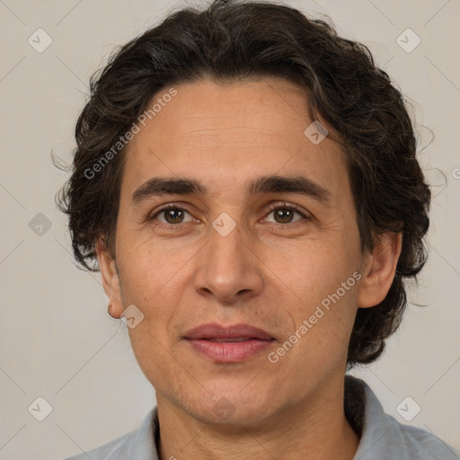 Joyful white adult male with medium  brown hair and brown eyes