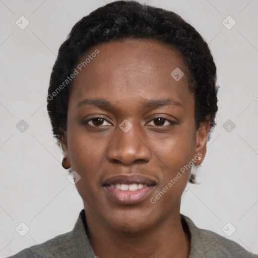 Joyful black young-adult female with short  black hair and brown eyes