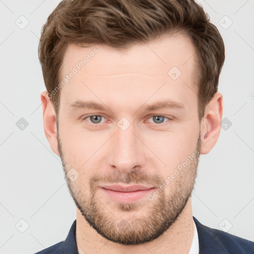 Joyful white young-adult male with short  brown hair and grey eyes