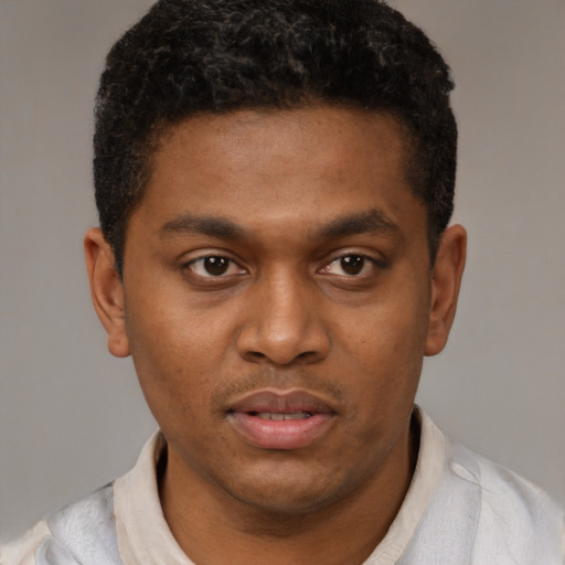 Neutral latino young-adult male with short  brown hair and brown eyes