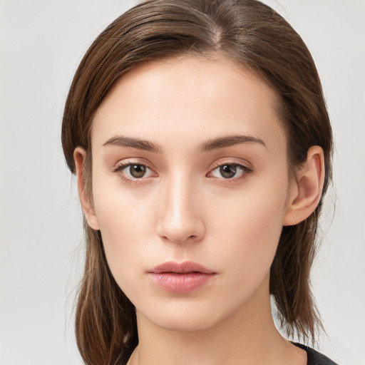 Neutral white young-adult female with medium  brown hair and brown eyes