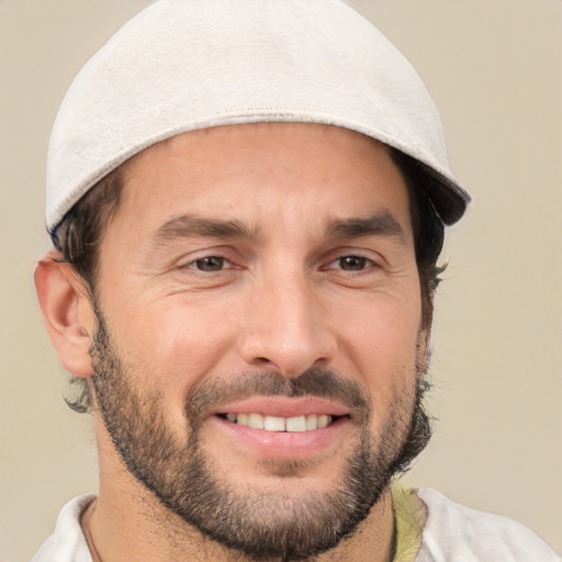 Joyful white adult male with short  brown hair and brown eyes