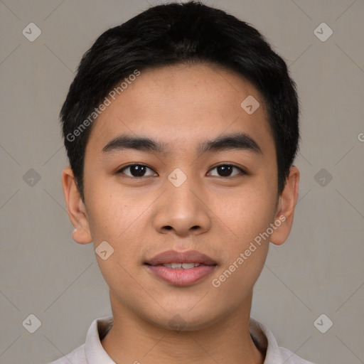 Joyful asian young-adult male with short  black hair and brown eyes