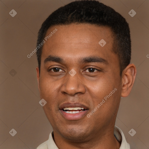 Joyful black young-adult male with short  brown hair and brown eyes