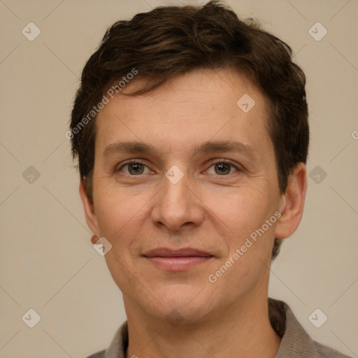 Joyful white adult male with short  brown hair and grey eyes