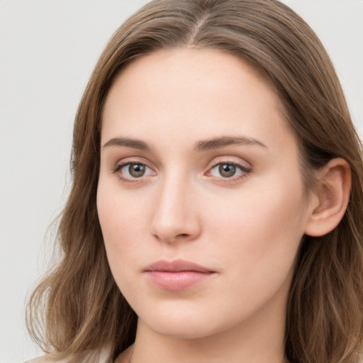 Neutral white young-adult female with long  brown hair and grey eyes