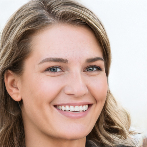 Joyful white young-adult female with long  brown hair and blue eyes