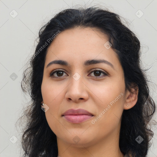 Joyful latino young-adult female with long  brown hair and brown eyes