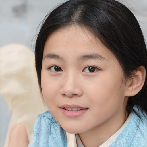 Joyful asian child female with medium  brown hair and brown eyes