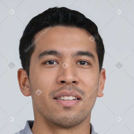 Joyful latino young-adult male with short  black hair and brown eyes