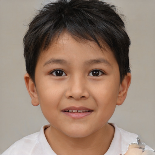 Joyful white child male with short  brown hair and brown eyes