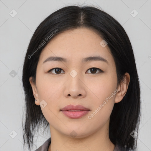 Joyful asian young-adult female with medium  black hair and brown eyes