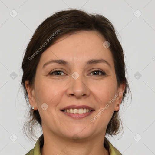 Joyful white adult female with medium  brown hair and grey eyes