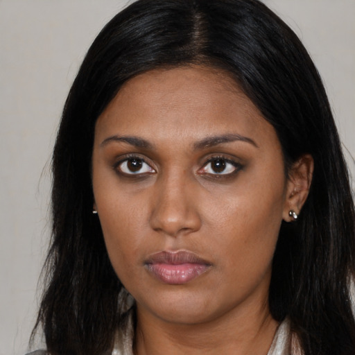 Neutral black young-adult female with long  black hair and brown eyes