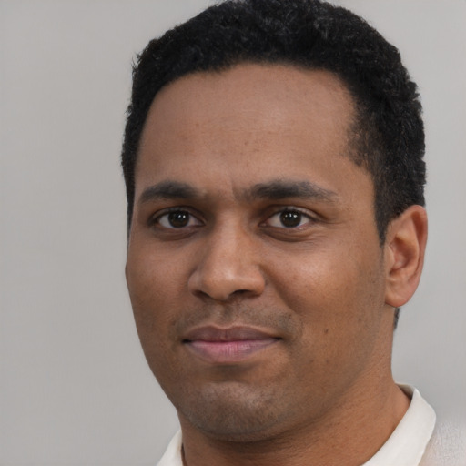 Neutral black young-adult male with short  black hair and brown eyes
