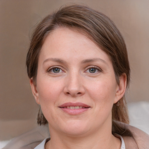 Joyful white young-adult female with medium  brown hair and blue eyes