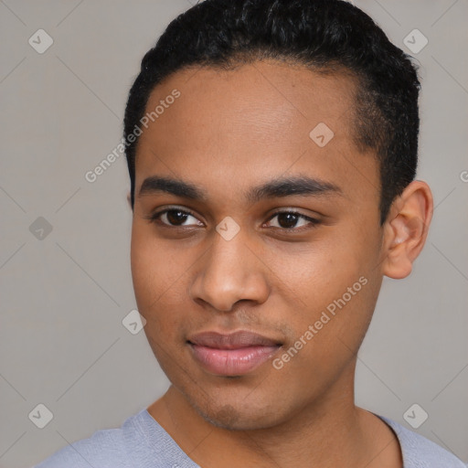 Joyful latino young-adult male with short  black hair and brown eyes