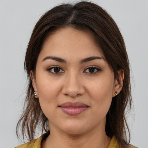 Joyful white young-adult female with medium  brown hair and brown eyes
