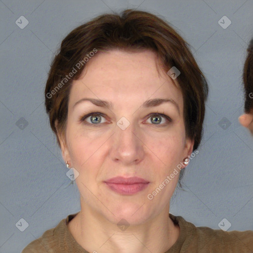 Joyful white adult female with short  brown hair and grey eyes