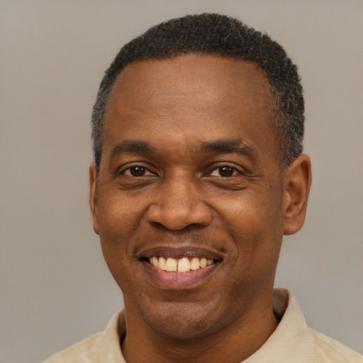 Joyful latino adult male with short  black hair and brown eyes