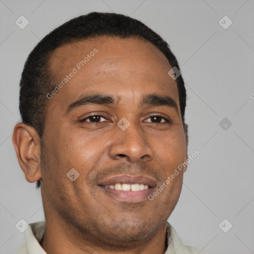 Joyful latino young-adult male with short  brown hair and brown eyes