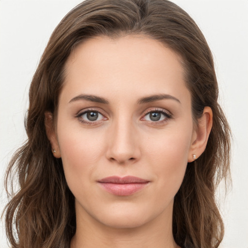 Joyful white young-adult female with long  brown hair and grey eyes