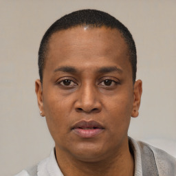 Neutral black young-adult male with short  black hair and brown eyes
