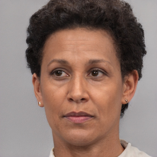 Neutral black adult female with short  brown hair and brown eyes