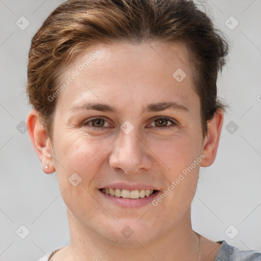 Joyful white young-adult female with short  brown hair and brown eyes