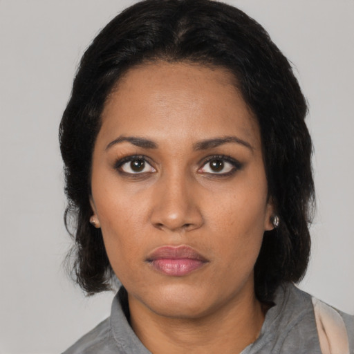 Neutral latino young-adult female with medium  black hair and brown eyes