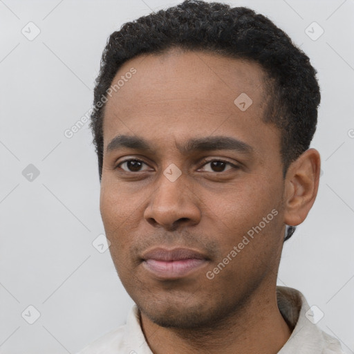 Neutral latino young-adult male with short  black hair and brown eyes