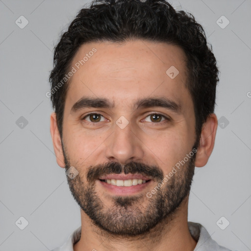 Joyful white young-adult male with short  black hair and brown eyes